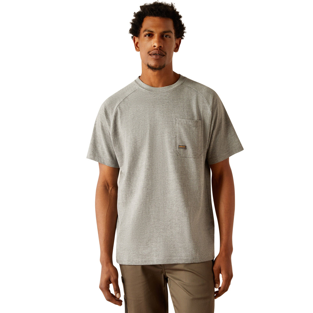 Person wearing a gray t-shirt with 'Ariat Workhogs' logo on the back