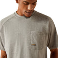 Person wearing a gray t-shirt with 'Ariat Workhogs' logo on the back