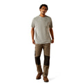 Person wearing a gray t-shirt with 'Ariat Workhogs' logo on the back