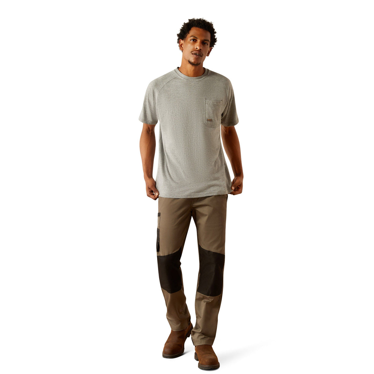 Person wearing a gray t-shirt with 'Ariat Workhogs' logo on the back