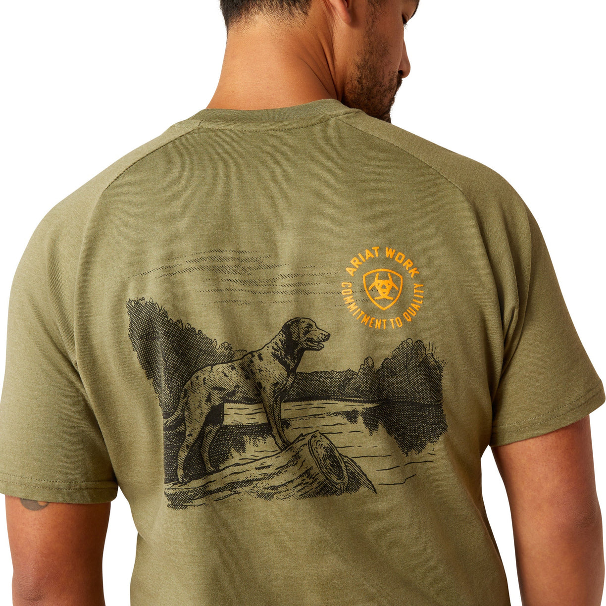 Man wearing a green t-shirt with a graphic design on the back, standing against a white background