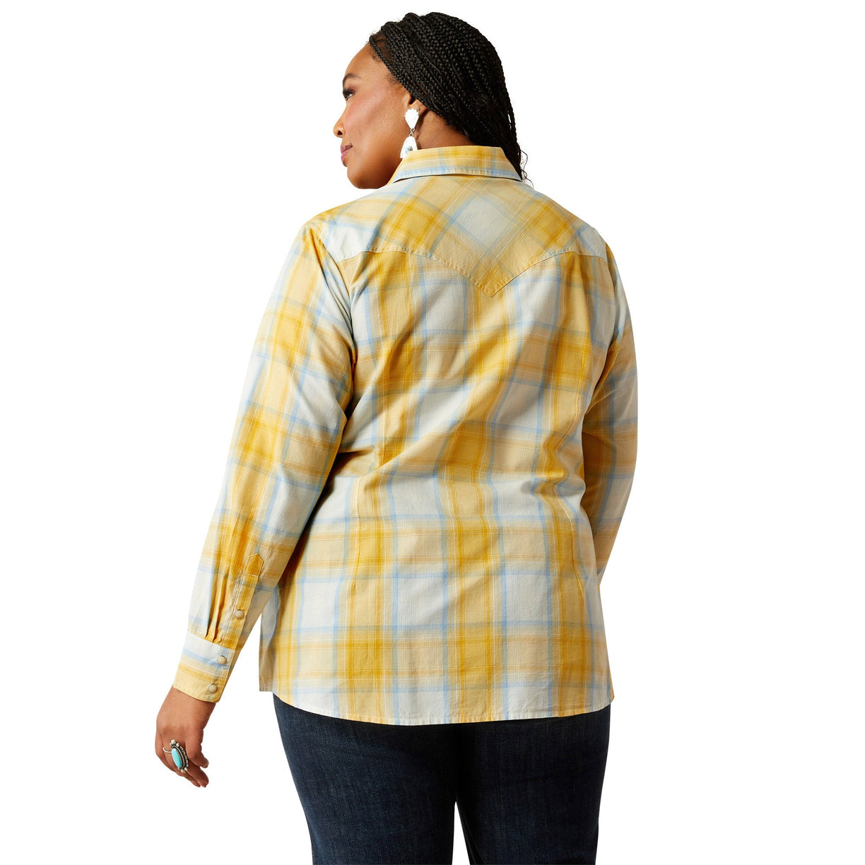 Woman wearing a yellow and blue plaid shirt on a white background