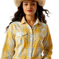 Woman wearing a yellow plaid shirt and cowboy hat on a white background