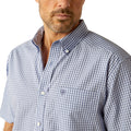 Man wearing a checkered shirt, jeans, and a cowboy hat on a white background