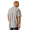 Man wearing a plaid short-sleeve shirt and jeans on a white background