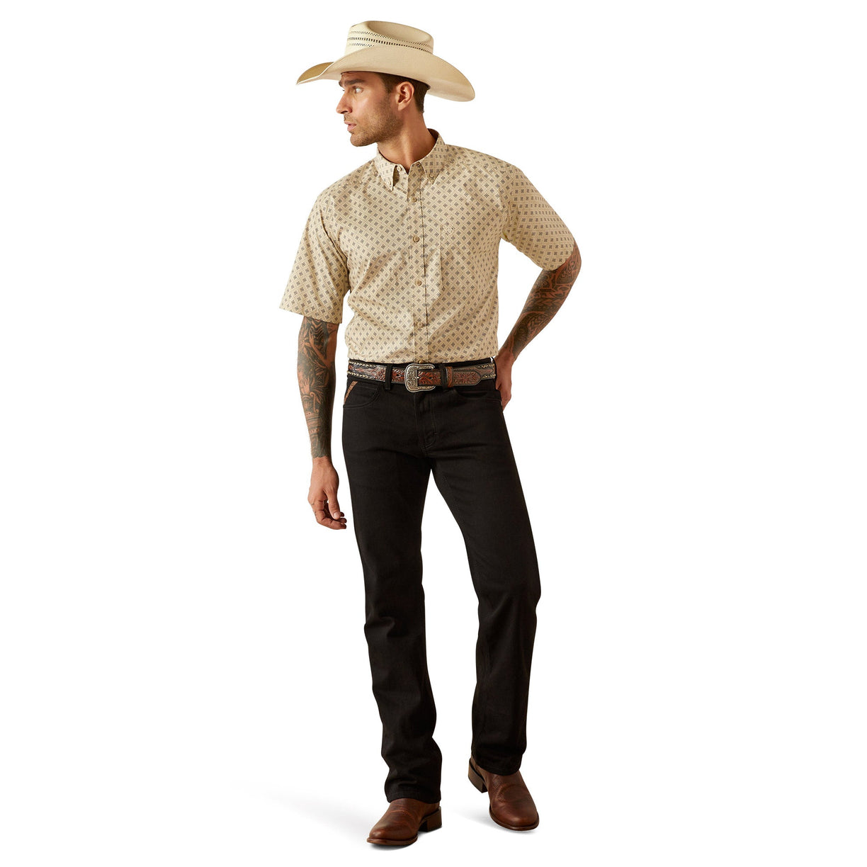 Man wearing a patterned shirt, black pants, and a cowboy hat on a white background