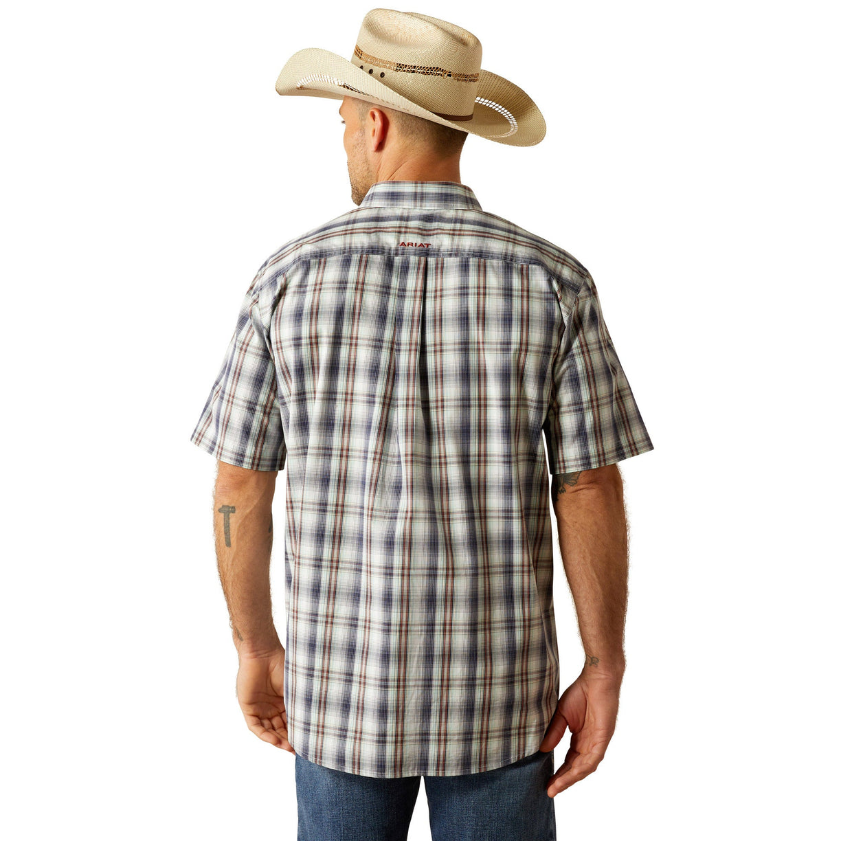 Man wearing a plaid shirt, jeans, and a cowboy hat on a white background