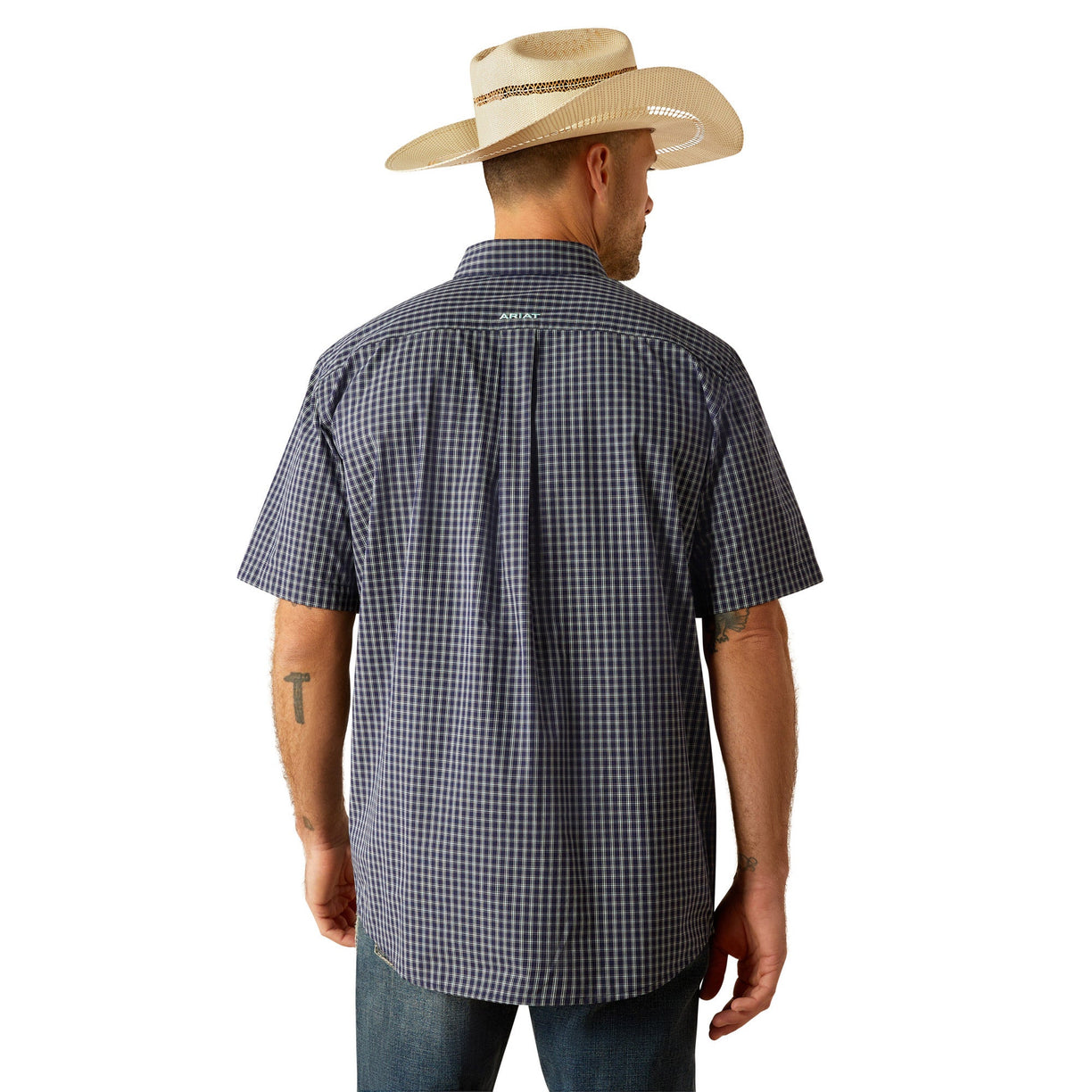 Man wearing a checkered shirt, jeans, and a cowboy hat on a white background