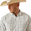 Man wearing a plaid shirt, cowboy hat, and jeans on a white background