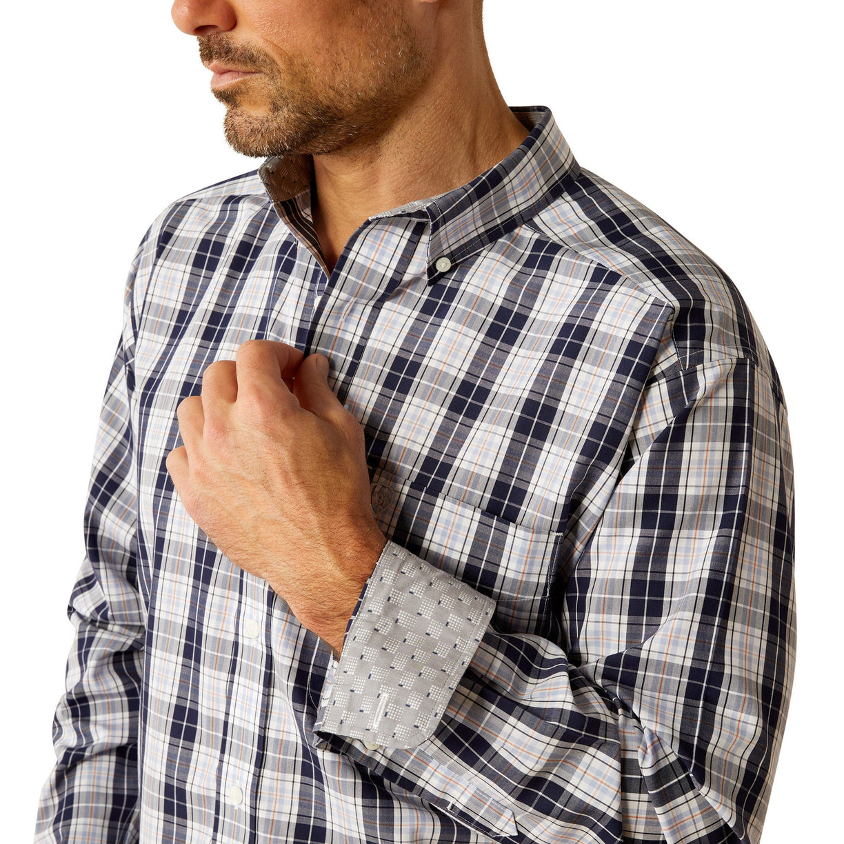 Man wearing a plaid shirt and jeans on a white background