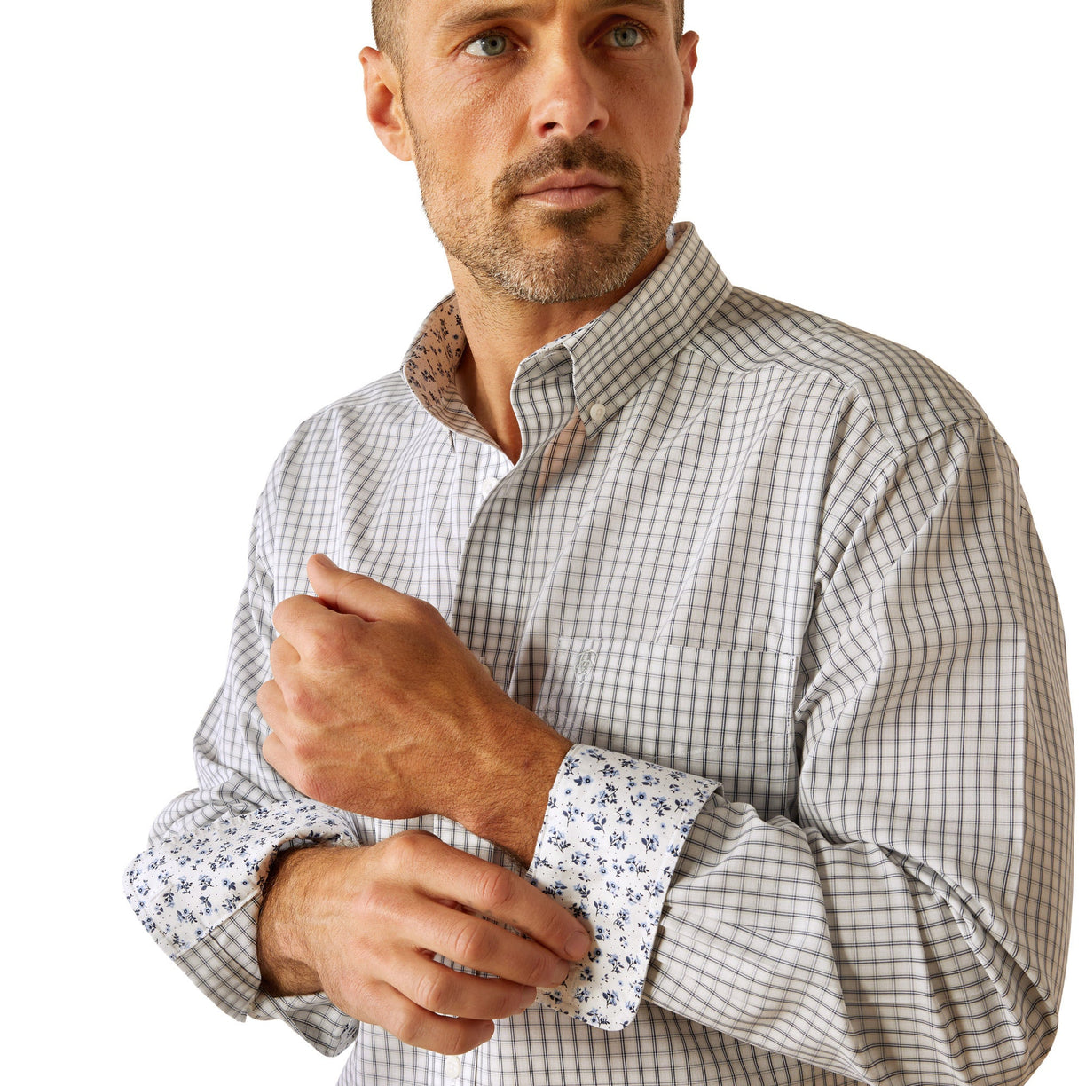 Man wearing a checkered shirt and jeans on a white background