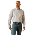 Man wearing a checkered shirt and jeans on a white background