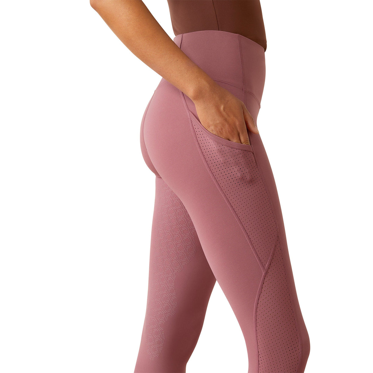 Pink leggings worn by a person on a white background