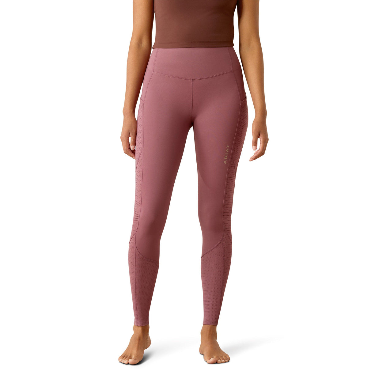 Pink leggings worn by a person on a white background