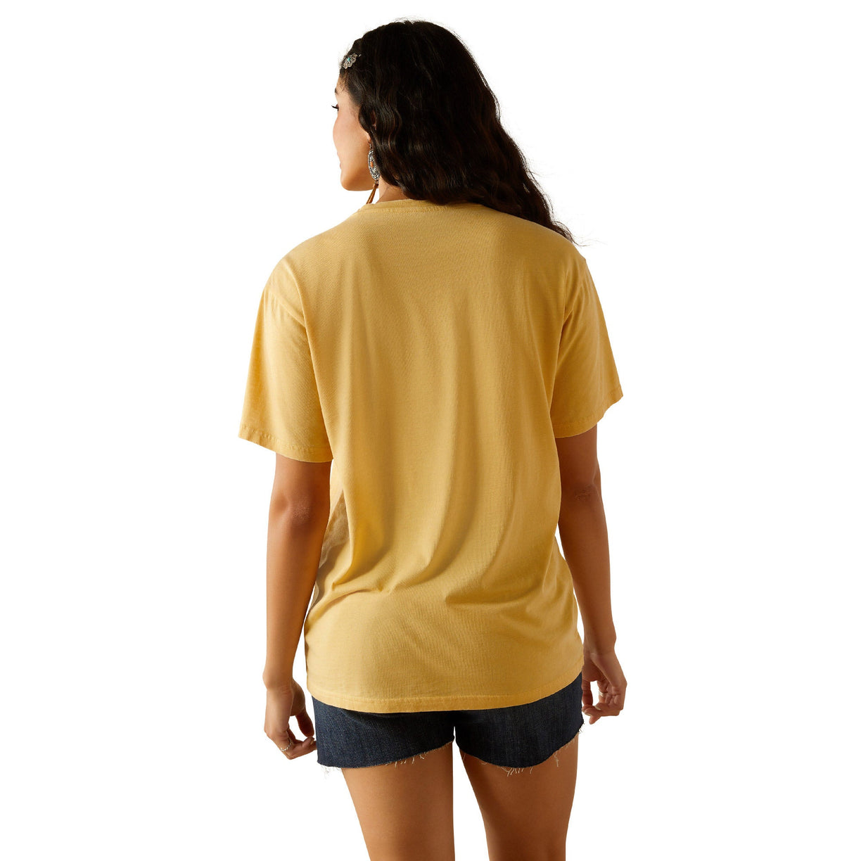 Person wearing a mustard yellow t-shirt and black shorts on a white background
