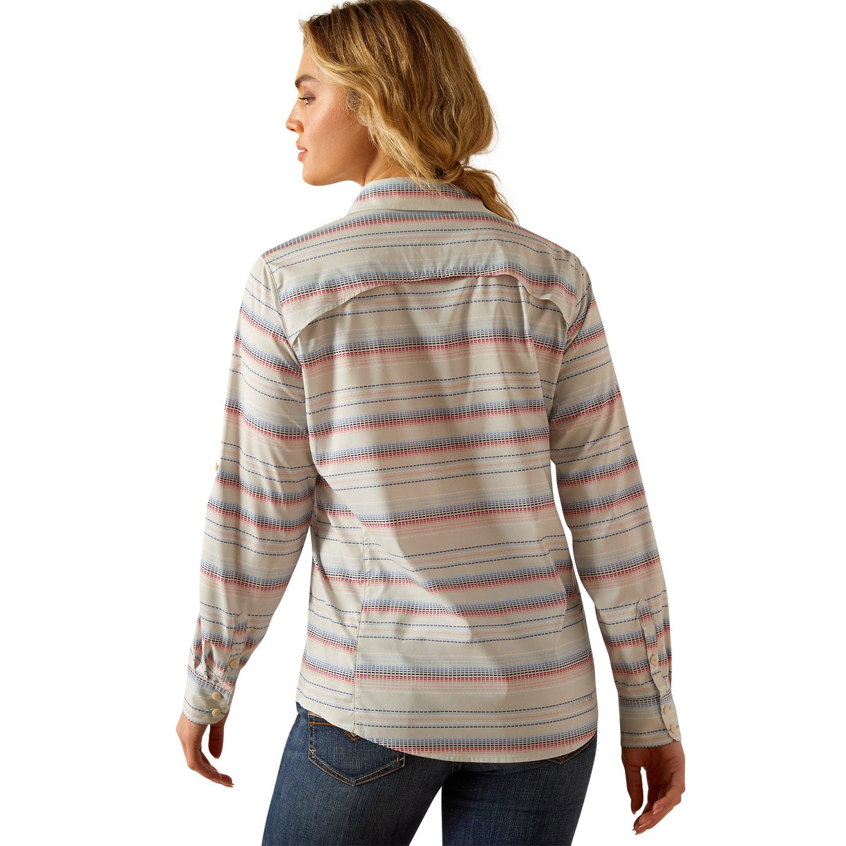 Woman wearing a striped shirt and jeans on a white background