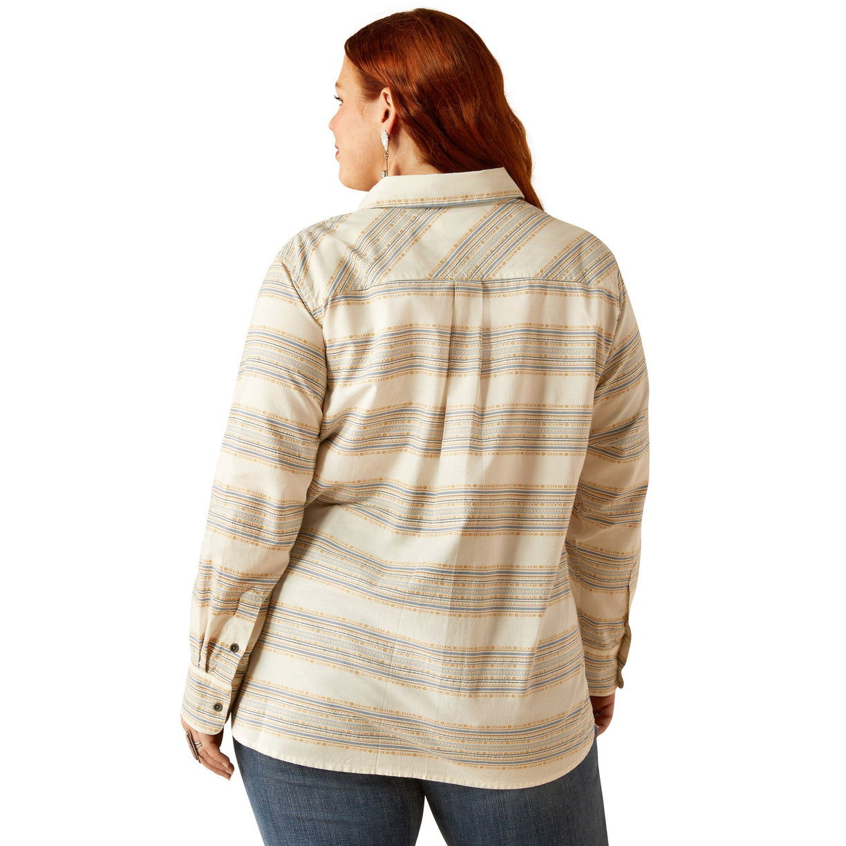 Woman wearing a beige plaid shirt on a white background