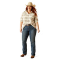 Woman wearing a striped shirt, jeans, and a cowboy hat on a white background