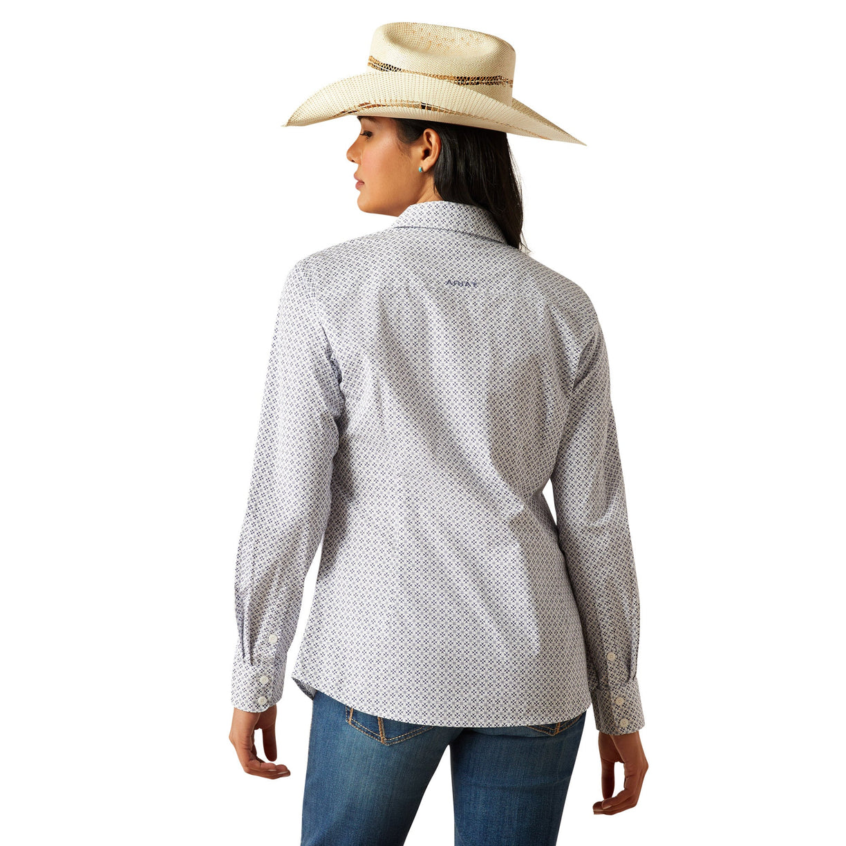 Woman wearing a patterned shirt, jeans, and a cowboy hat on a white background