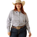Woman wearing a patterned shirt, jeans, and a cowboy hat on a white background