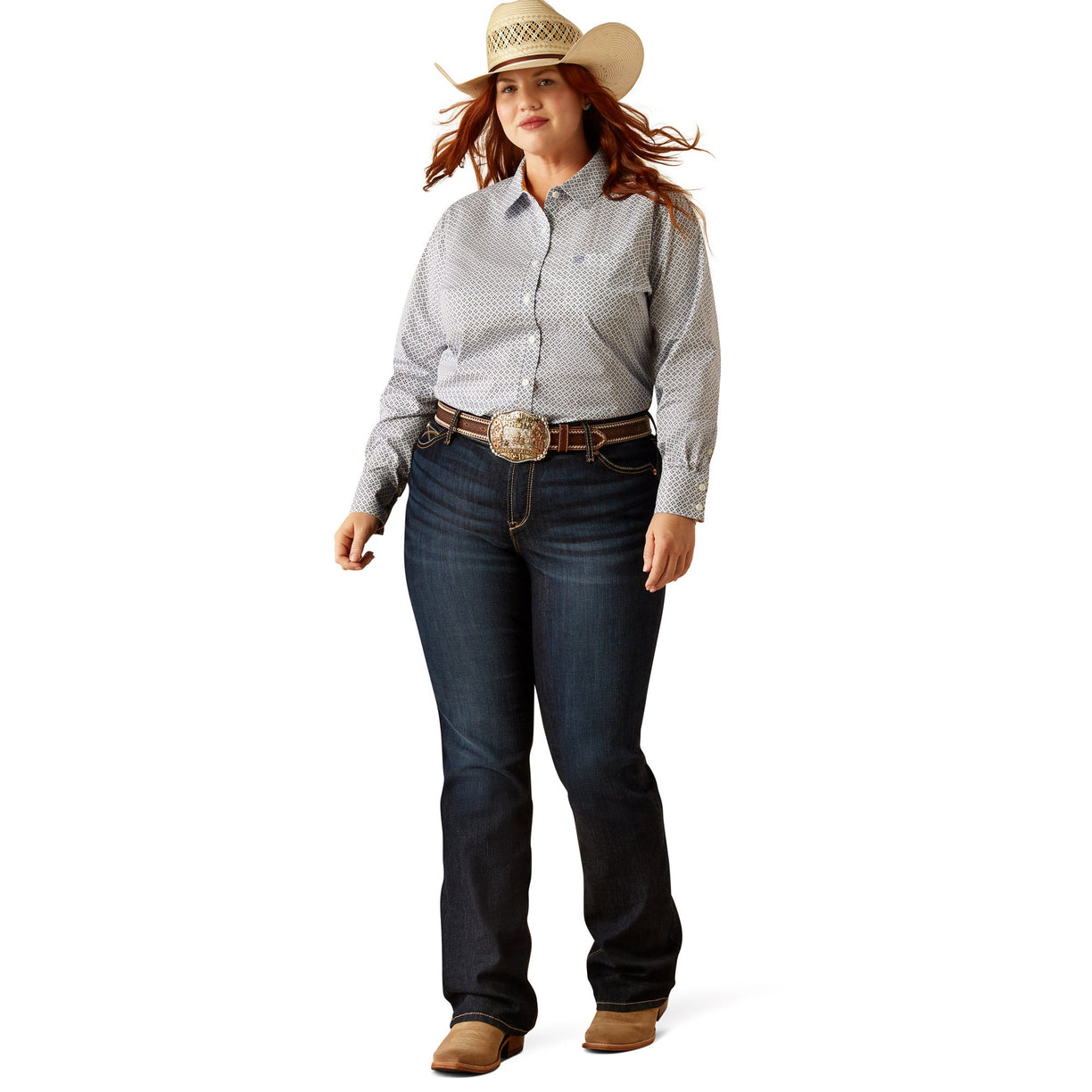 Woman wearing a patterned shirt, jeans, and a cowboy hat on a white background
