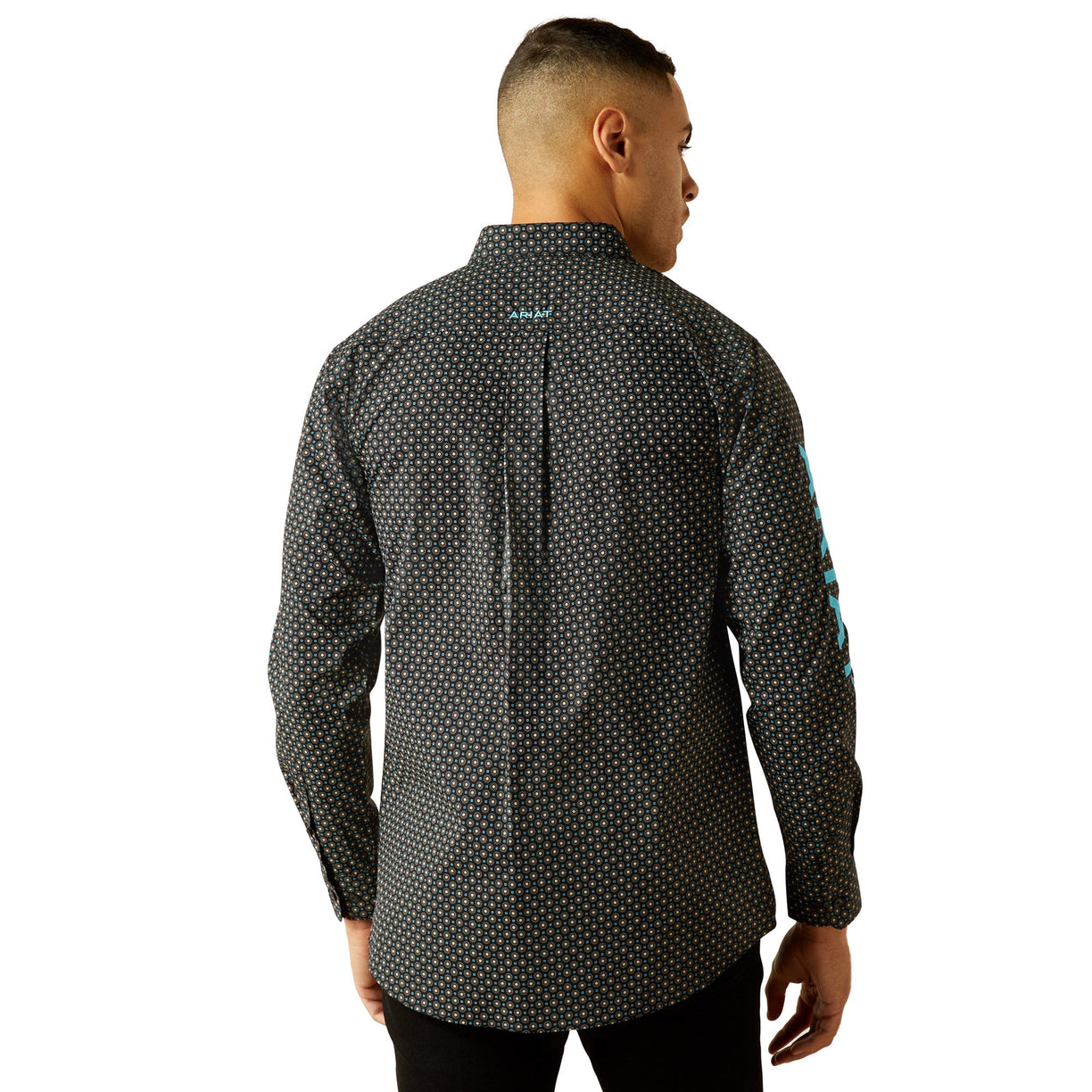 Man wearing a patterned shirt on a white background