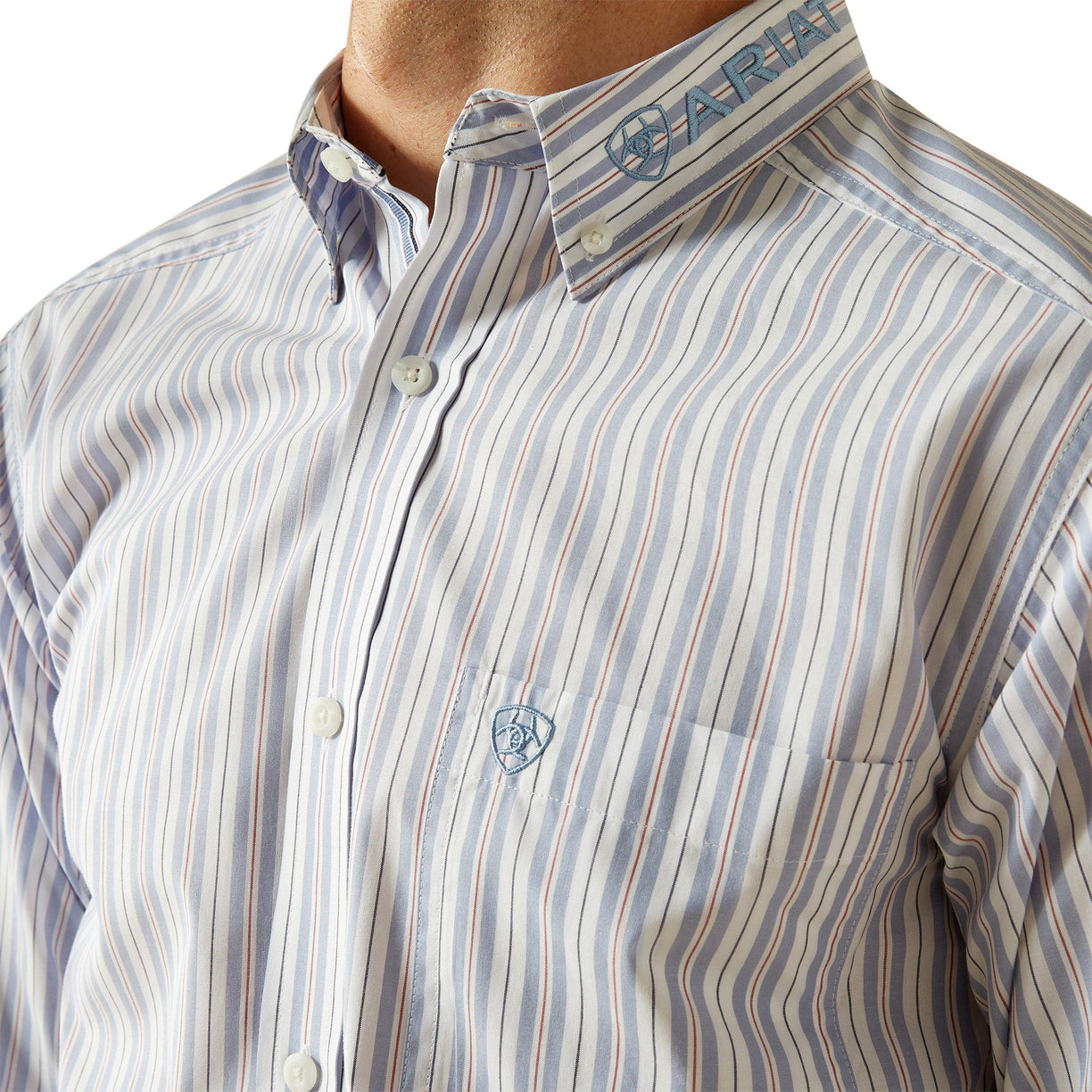 Close-up of a striped shirt with a brand logo on a white background
