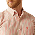 Man wearing a striped shirt with a brand logo on a white background