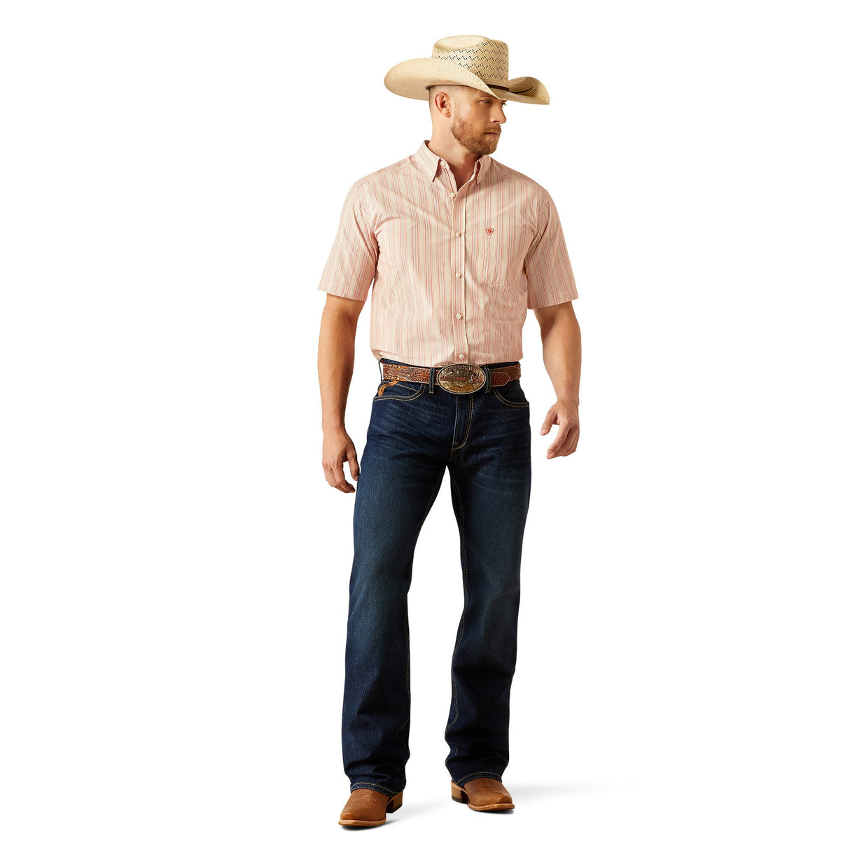 Man wearing a pink shirt, blue jeans, and a straw cowboy hat on a white background