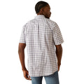 Man wearing a plaid shirt and jeans on a white background