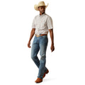 Man wearing a checkered shirt, jeans, and a cowboy hat on a white background
