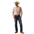 Man wearing a plaid shirt, jeans, and cowboy hat on a white background