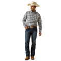 Man wearing a plaid shirt, jeans, and a cowboy hat on a white background
