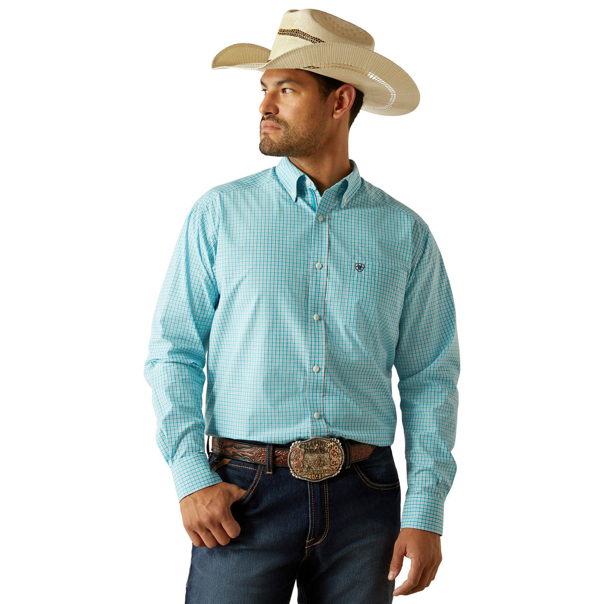 Man wearing a light blue checkered shirt, dark jeans, and a straw cowboy hat on a white background
