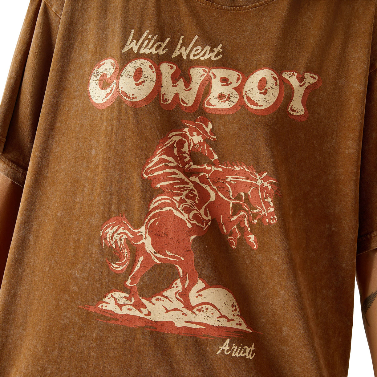 Brown t-shirt with 'Wild West Cowboy' text and graphic of a cowboy on a horse.