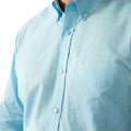 Light blue button-up shirt with a brand logo on a white background
