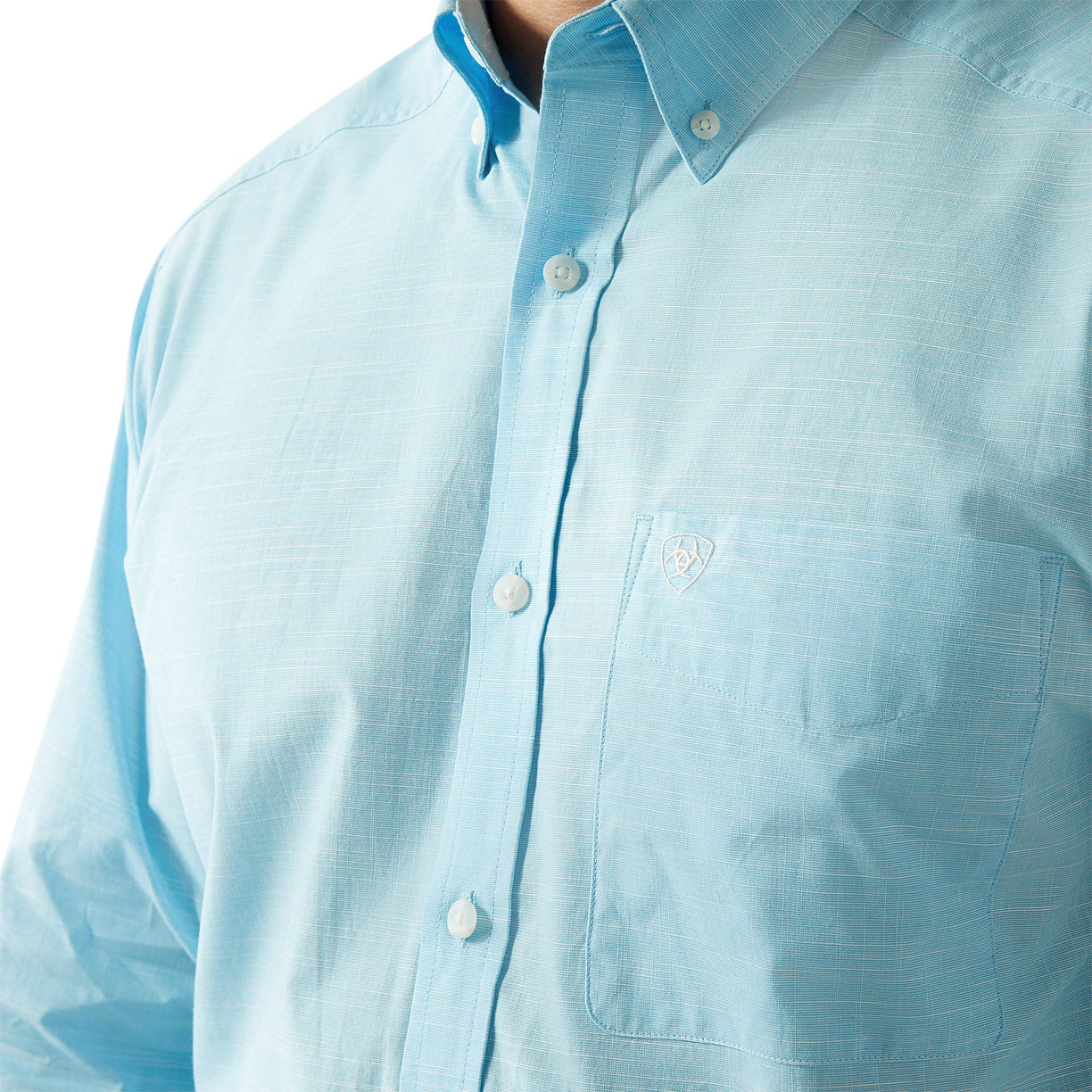 Light blue button-up shirt with a brand logo on a white background