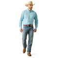 Man wearing a light blue shirt, jeans, and a cowboy hat on a white background