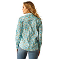 Woman wearing a floral patterned shirt on a white background