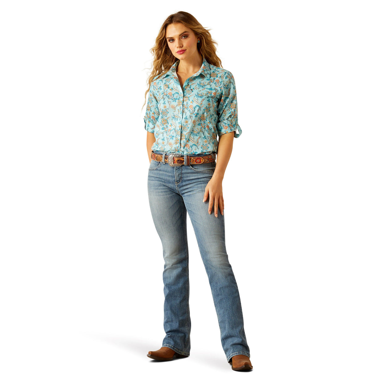 Woman wearing a floral shirt and jeans on a white background