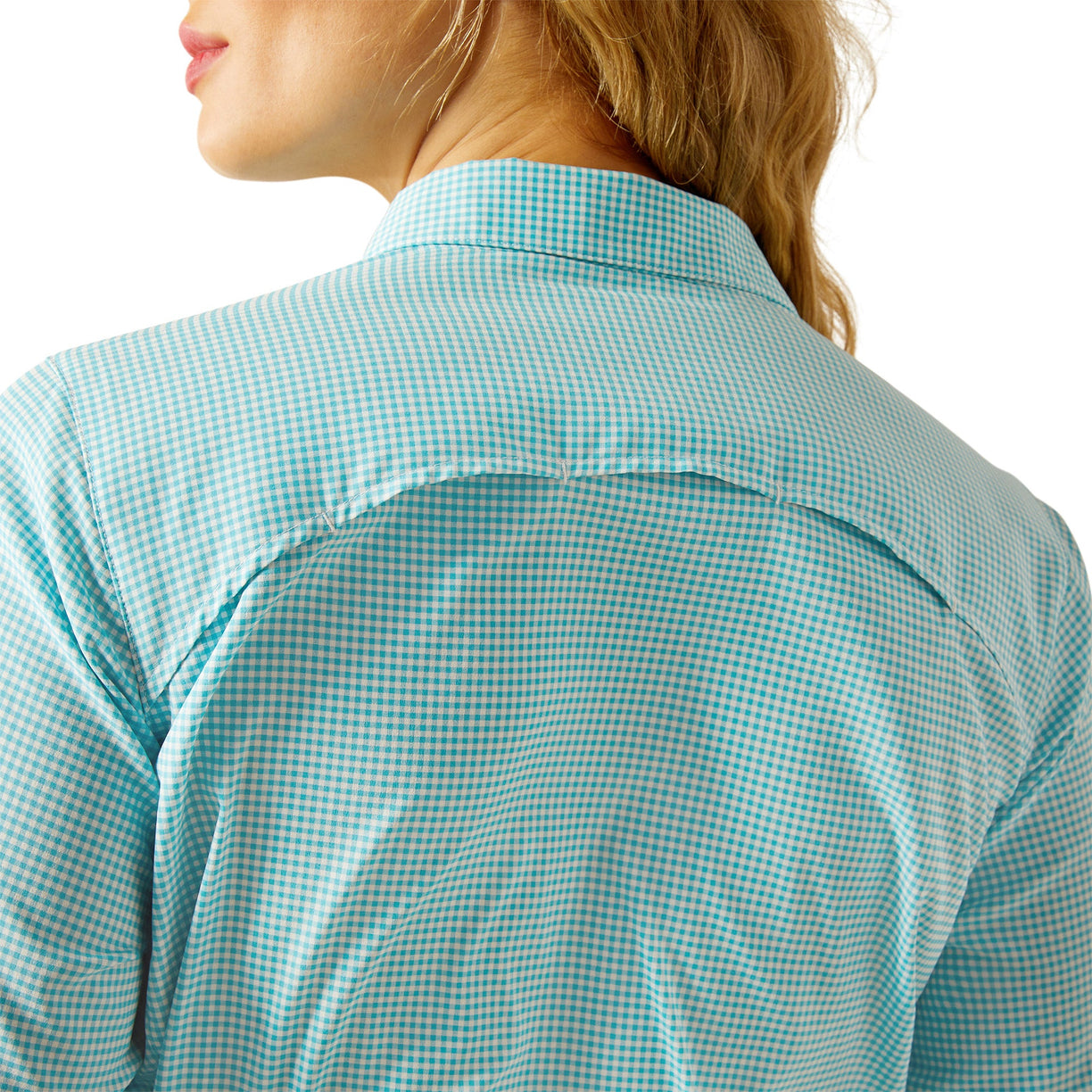 Close-up of a person wearing a green and white checkered shirt on a white background