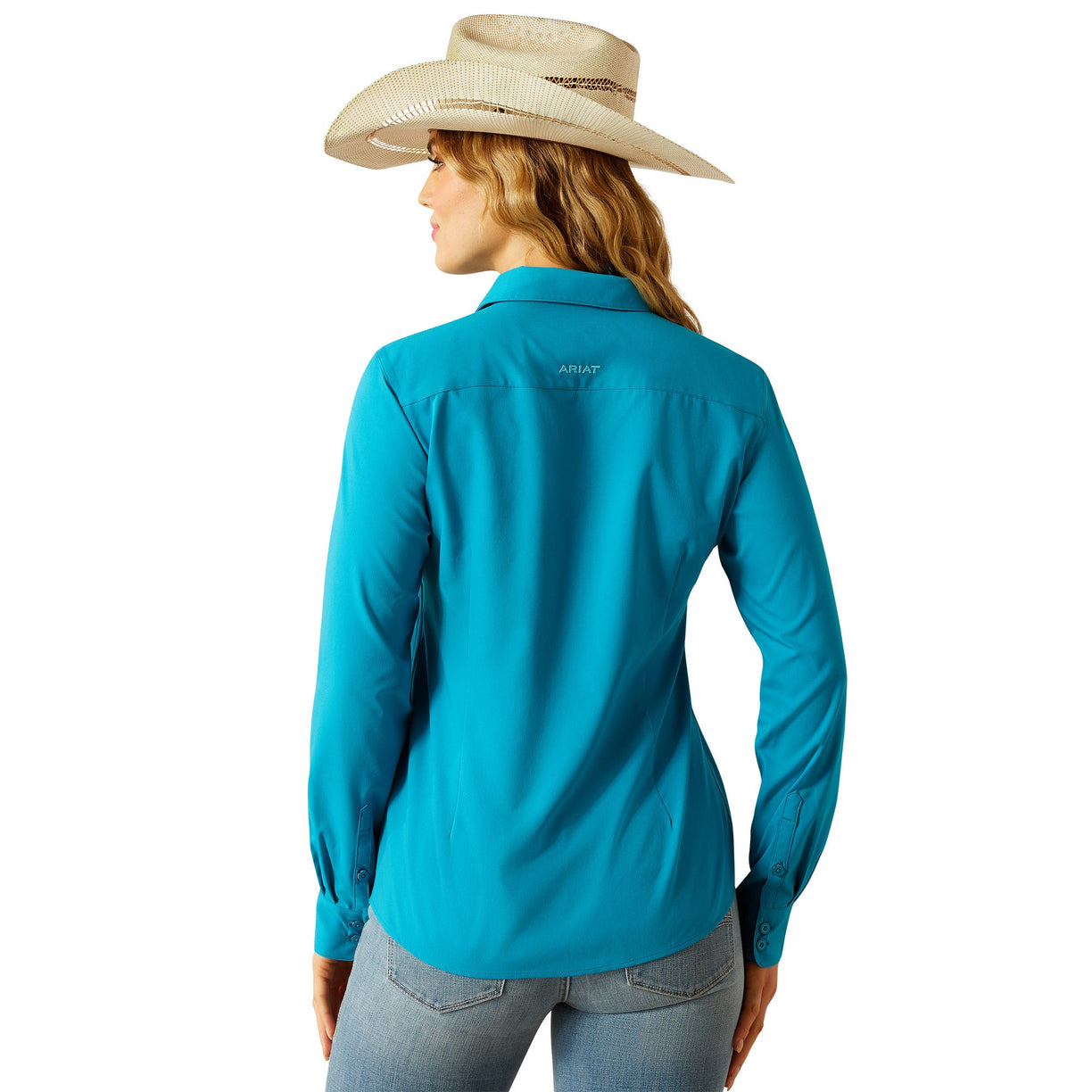 Person wearing a turquoise long-sleeve shirt and beige hat on a white background