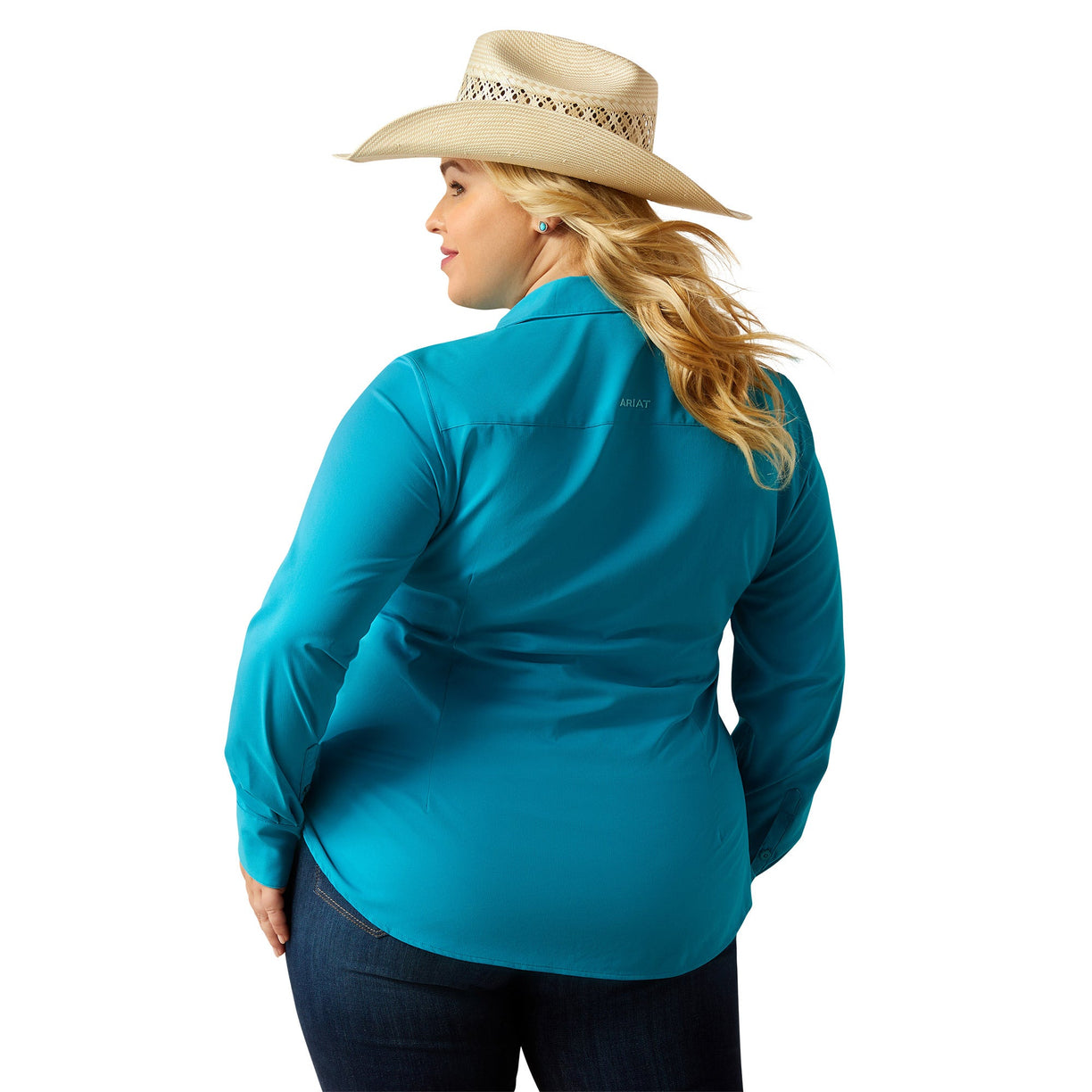 Woman wearing a turquoise shirt and beige cowboy hat on a white background