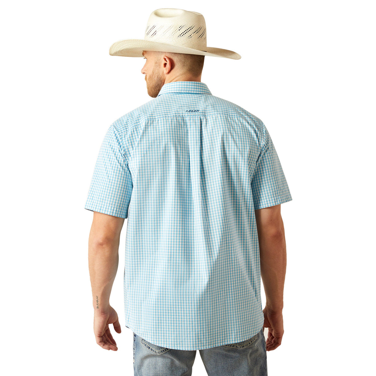 Man wearing a light blue checkered shirt and white cowboy hat on a white background