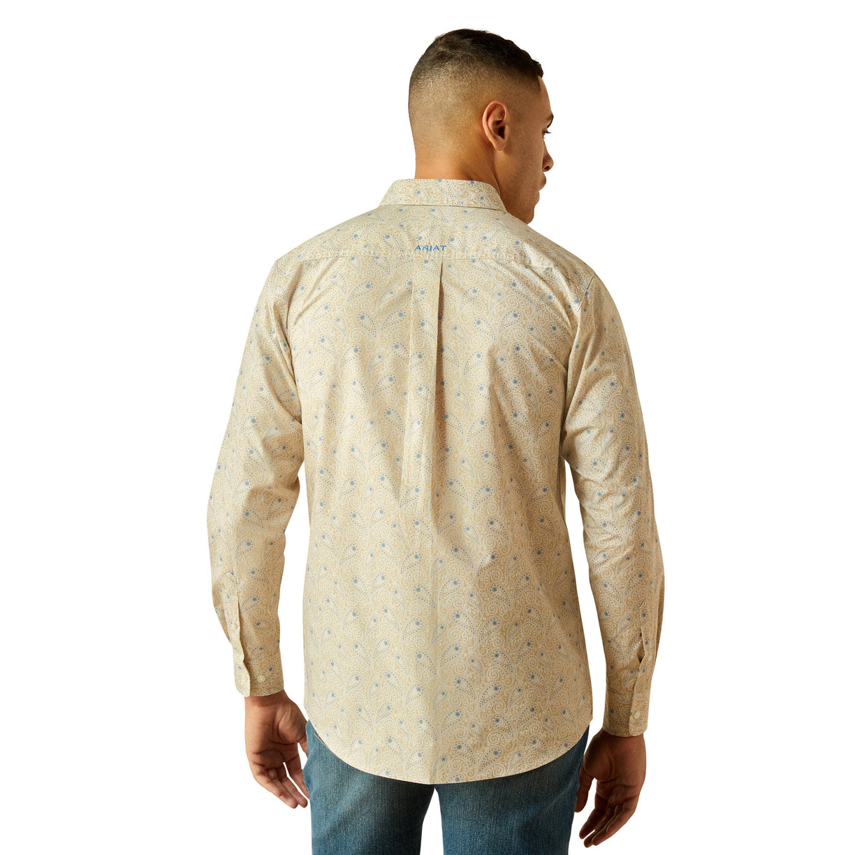 Man wearing a beige patterned shirt on a white background