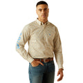 Man wearing a beige patterned shirt with blue sleeves on a white background