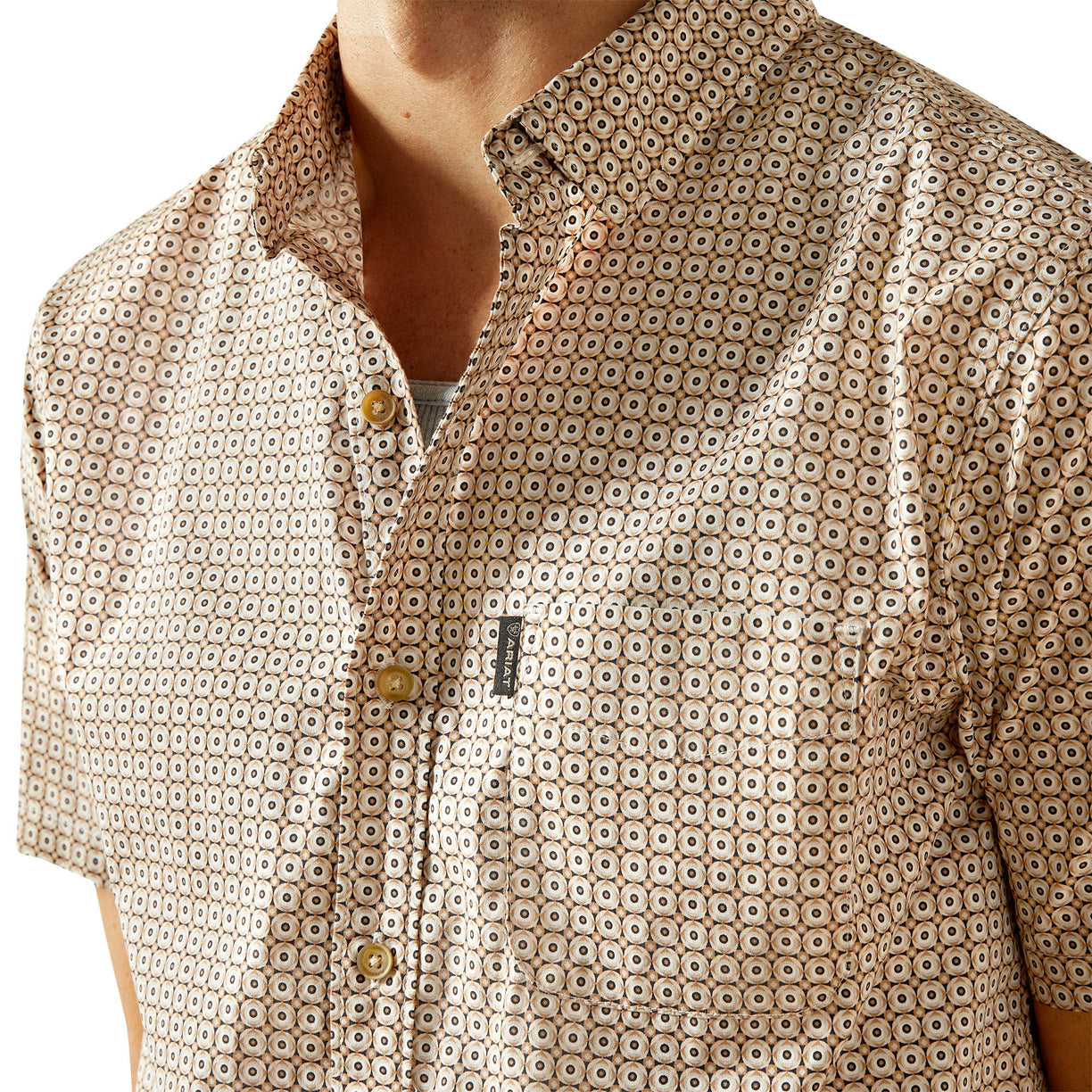 Close-up of a patterned shirt with a visible brand logo.