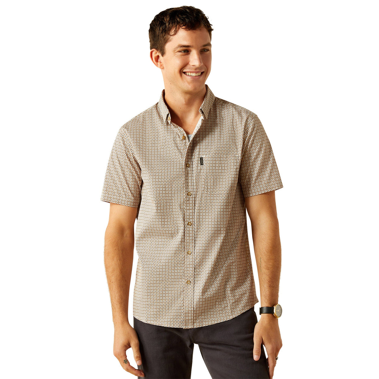 Man wearing a patterned short-sleeve shirt on a white background