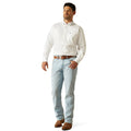 Man wearing a white dress shirt and light blue jeans on a white background