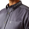 Gray shirt with Ariat logo on collar and chest pocket